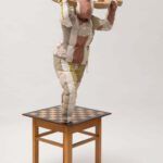 The Warrior 2022 140 x 70 x 65 cm. Stool, chessboard, wooden ornaments, fabric and thread