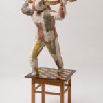 The Warrior 2022 140 x 70 x 65 cm. Stool, chessboard, wooden ornaments, fabric and thread